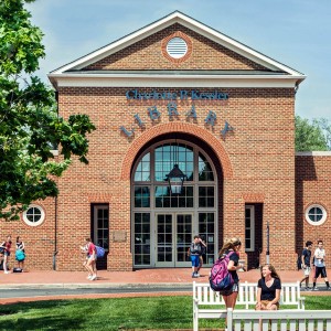 Exterior of the Charlotte P. Kessler Library with student walking around in front of it.