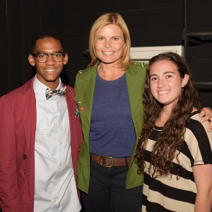 Three people posing for a picture.