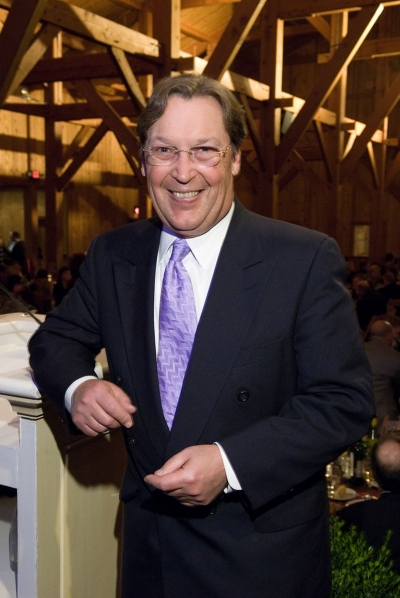 Ralph Johnson, 2006 McCoy Award winner, leaning against podium.